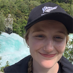 girl posing in front of river